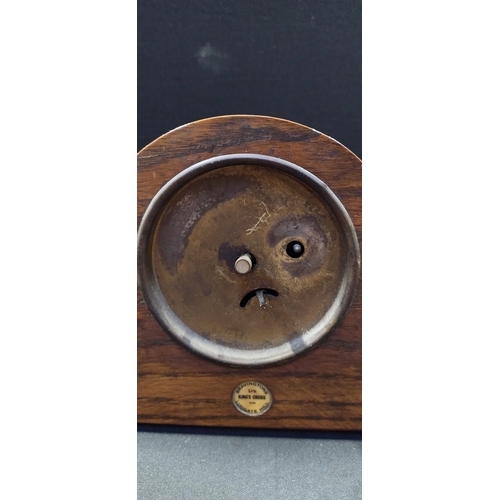 203 - Wind up mantle clock retailed by Bravingtons Ltd of London. Measures approx 16 x 29.5 x 7.5 cm