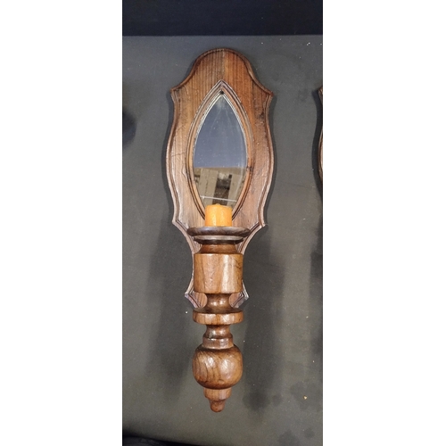 210 - Two vintage mirrored wooden wall sconces with candle holders. Measures approx 51 x 16 cm