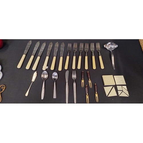 211 - 4 Wood Handle brass cheese forks and cutlery and a vintage tangram puzzle