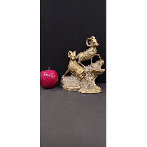 213 - Solid Brass  mountain goats on a outcrop. Measures approx  21 x 18.5 x 12 cm