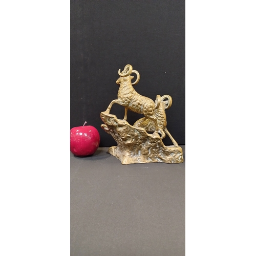 213 - Solid Brass  mountain goats on a outcrop. Measures approx  21 x 18.5 x 12 cm