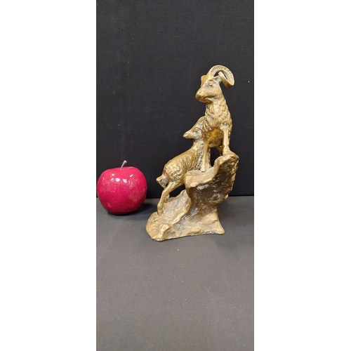 213 - Solid Brass  mountain goats on a outcrop. Measures approx  21 x 18.5 x 12 cm