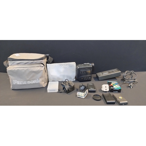 221 - Panasonic VHS-C Movie camera. NV S100. Battery charger, battery, lens and camera bag