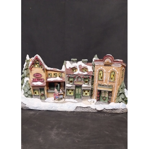 227 - Electric Illuminated village scene with model trees,  and battery operated trees, toy shop wax burne... 