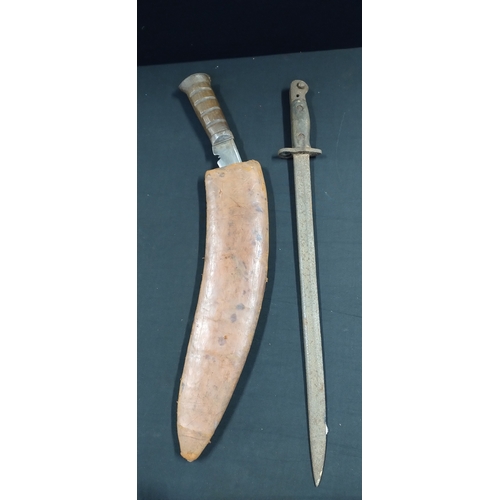 245 - Napolese Kukri knife and leather sheath with marking etched within and a British Sword pattern bayon... 