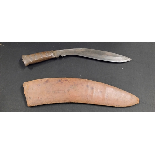 245 - Napolese Kukri knife and leather sheath with marking etched within and a British Sword pattern bayon... 