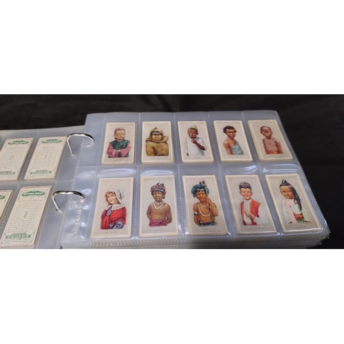 255 - Two file books containing Hundreds of various vintage cigarette cards