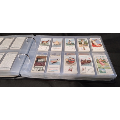 255 - Two file books containing Hundreds of various vintage cigarette cards