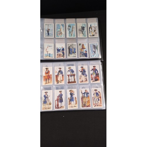 255 - Two file books containing Hundreds of various vintage cigarette cards