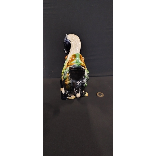 266 - Figurine of a tang horse with drip glaze. Measures approx H 19 x W 20 x D 9 cm