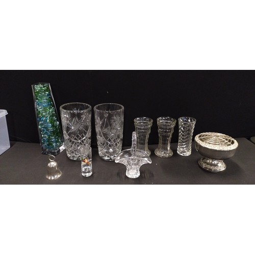 284 - Collection of pin wheel crystal vases, barrel vases, silver plated flower posy vase and other items