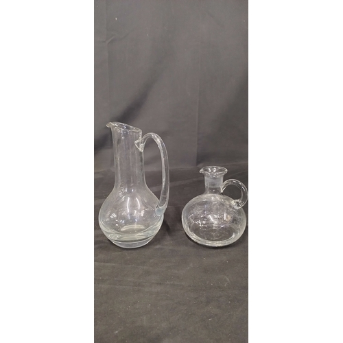 410 - 4 x decanter and pitcher jugs various sizes and styles