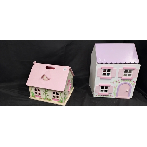 411 - Two wooden dolls houses with some furniture and figures