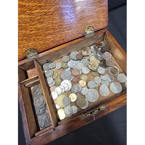 478 - A large collection of mixed coins.  With wooden box