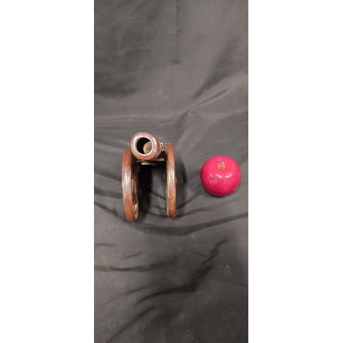 34 - Heavy Cast Iron cannon With a brown Lustre Finish with place for pokers to rest inside. Measures app... 