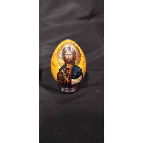 36 - Two Orthodox wooden easter eggs with  24k gold paint featuring the image of christ and the image of ... 