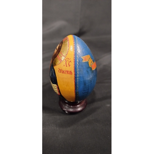 36 - Two Orthodox wooden easter eggs with  24k gold paint featuring the image of christ and the image of ... 