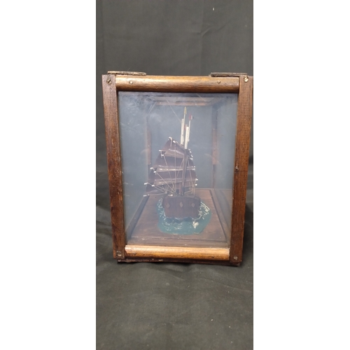 44 - Miniature ship in a display box. Measures approx H 19 x 22 x D 14 cm