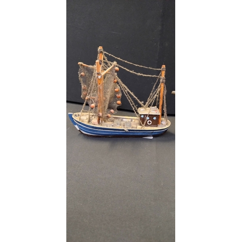 62 - Two miniature model ships one fishing boat and one Santa Maria sail boat