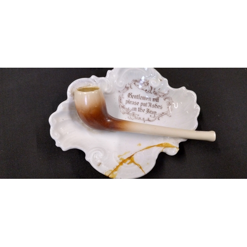 65 - Pipe ashtray with saying and 8 clay pipe pieces