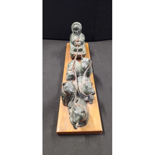 73 - Sculpture of Inuit Eskimos in Sled with Pack of Dogs on a Wooden Base