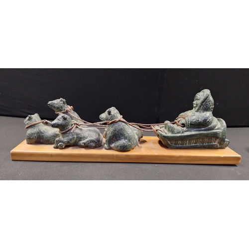 73 - Sculpture of Inuit Eskimos in Sled with Pack of Dogs on a Wooden Base