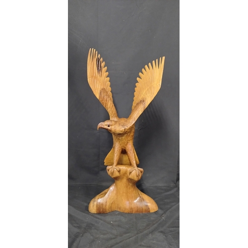 75 - Very large wooden eagle made from 1 solid piece of wood. Measures approx H 79.5 x W 36 x D 20 cm