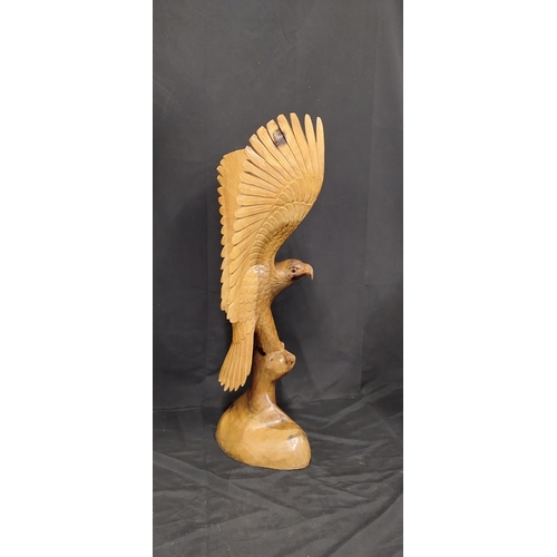 75 - Very large wooden eagle made from 1 solid piece of wood. Measures approx H 79.5 x W 36 x D 20 cm