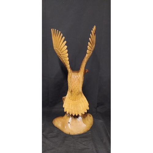 75 - Very large wooden eagle made from 1 solid piece of wood. Measures approx H 79.5 x W 36 x D 20 cm