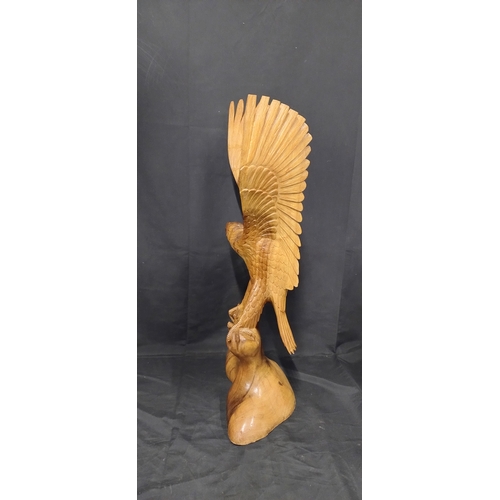 75 - Very large wooden eagle made from 1 solid piece of wood. Measures approx H 79.5 x W 36 x D 20 cm