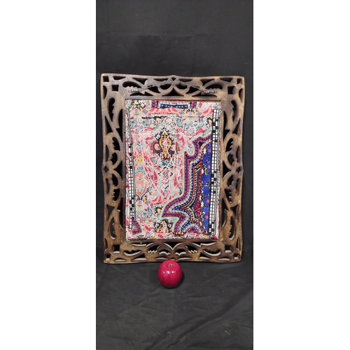 76 - Dark wood carved wall hanging frame with a needlework cushioned design in the centre. Measures appro... 