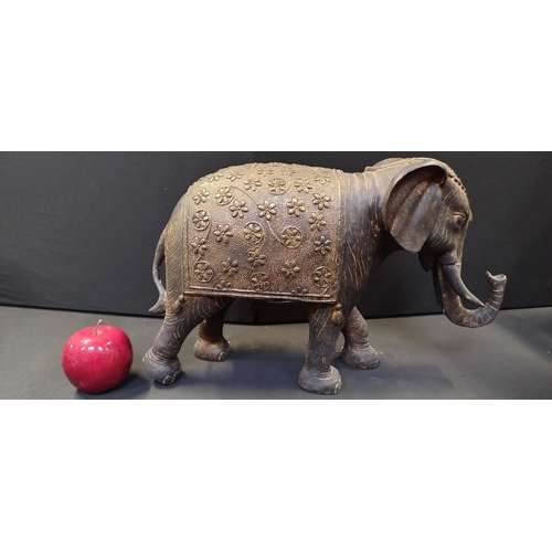 92 - Large resin statue of a decorated Indian elephant. Measures approx H 27 x W 44 x D 14 cm