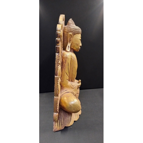 96 - Wood carving of a golden Buddha. Measures approx H 42 x W 31.5 x D 10 cm