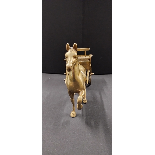 115 - Solid brass horse and cart. Measures approx H 21.5 x W 38 x D 14 cm