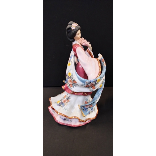 147 - Two oriental figurines from the Danbury mint, The Plum Blossom Princess and Iris Princess