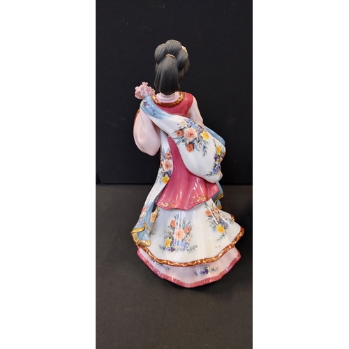 147 - Two oriental figurines from the Danbury mint, The Plum Blossom Princess and Iris Princess