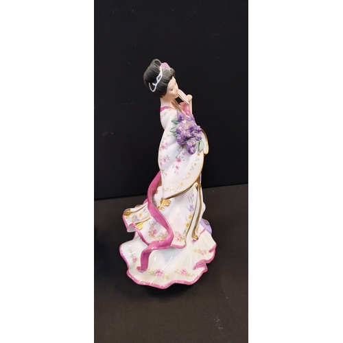 147 - Two oriental figurines from the Danbury mint, The Plum Blossom Princess and Iris Princess