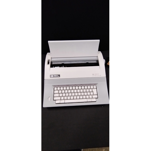 195 - Smith Corona XL 2900. Spell Right Dictionary electric typewriter with accessories. Tested for power ... 