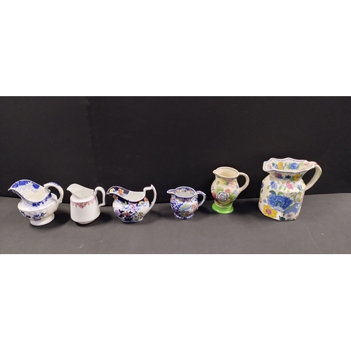 204 - Collection of 11 porcelain jugs including, Maling ware, Wood and Sons, Royal Doulton, and other make... 