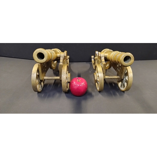 228 - Pair of Solid brass cannons. Measures approx H 21 x W 45.5 x D 13