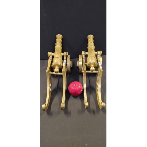 228 - Pair of Solid brass cannons. Measures approx H 21 x W 45.5 x D 13