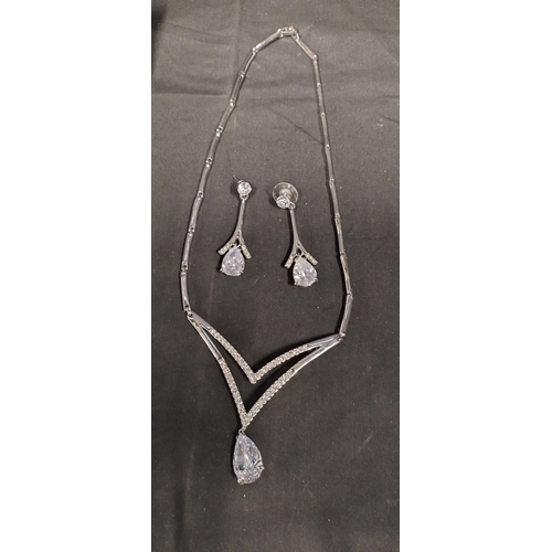 24 - 4 sets of necklaces and earrings with clear stones and a sterling silver and blue shell earrings and... 