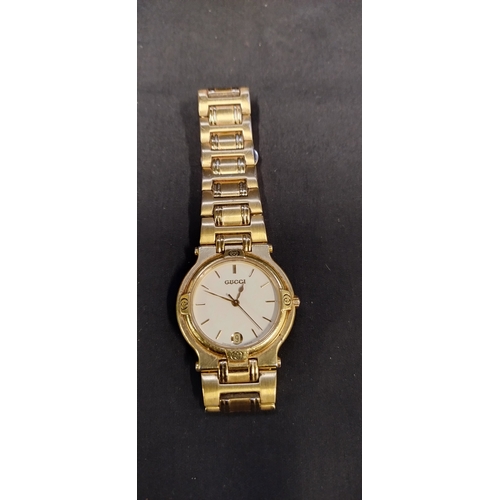 25 - Gold plated Gucci timepiece 7 jewel