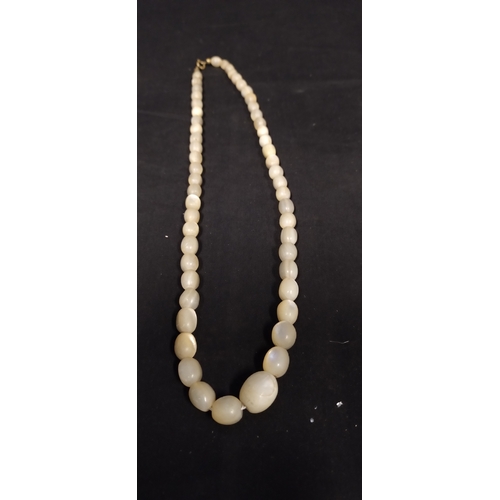 38 - Four various sized mother of pearl necklaces