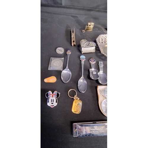 131 - Mixed lot of brass, silver plated and other items including harmonica, sugar nips perfume bottle and... 