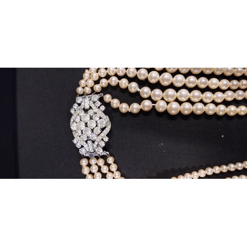 218 - Six faux pearl necklaces some with rhinestone clasps