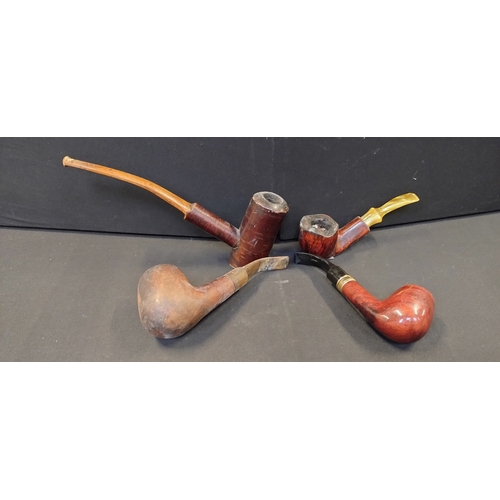 241 - 4 various smoking pipes made of various wood