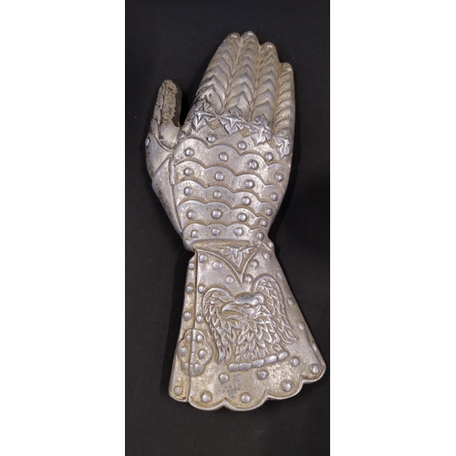 262 - Cast metal chrome coloured wall hanging decorative gauntlet. Measures approx H 11.5 x W 28