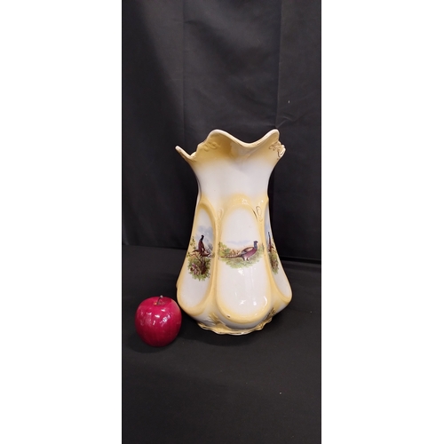 341 - Large ceramic pitcher with pheasant decoration