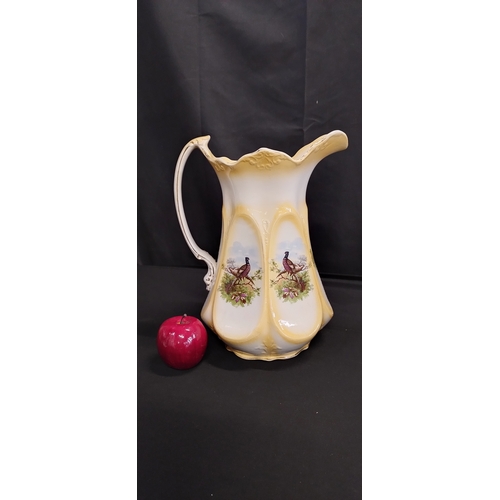 341 - Large ceramic pitcher with pheasant decoration